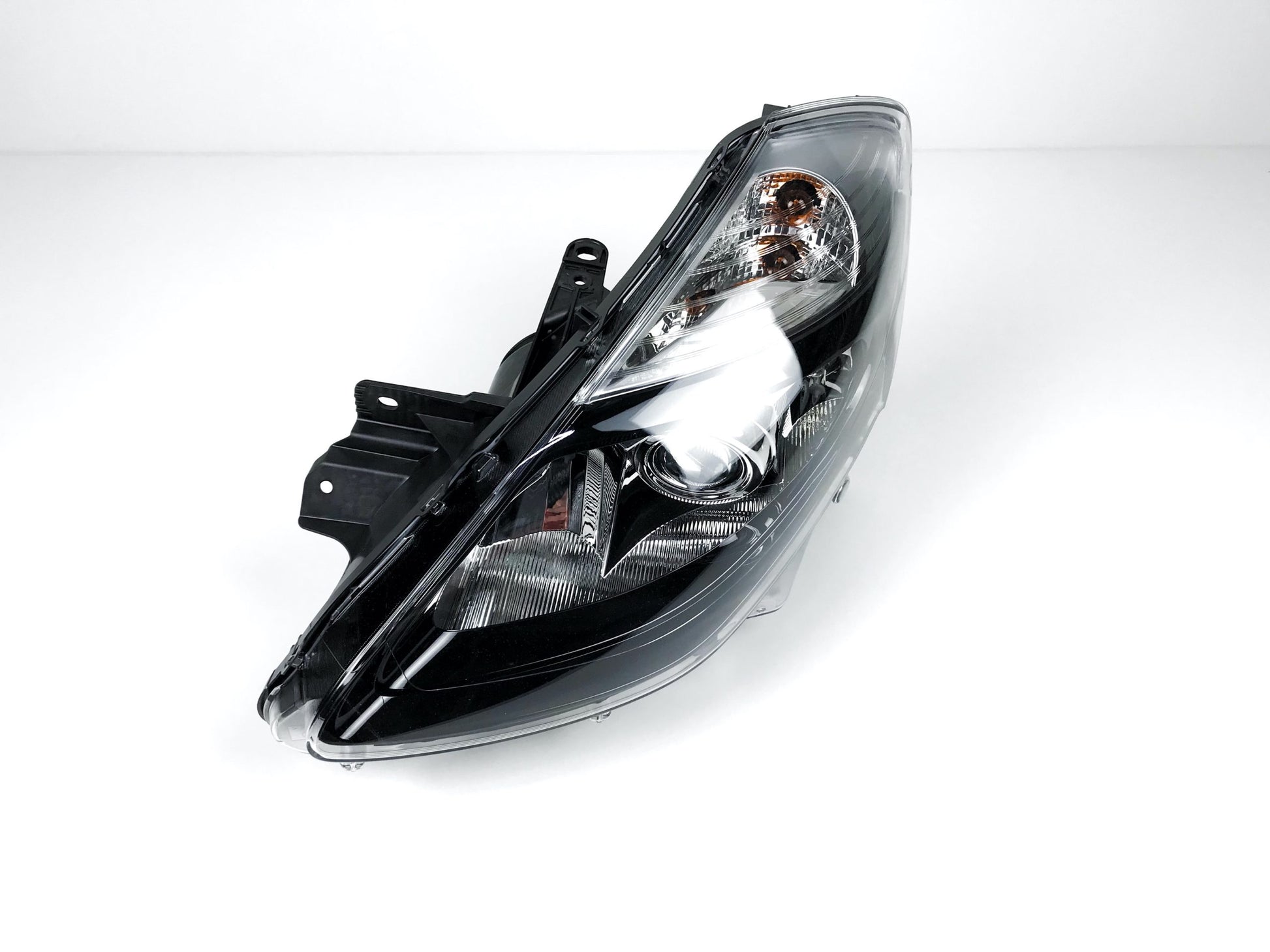Pièce d'origine Phare gauche noir avec lentille pour Renault Clio III phase 2 260605782R.